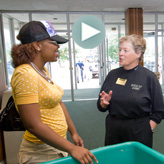 President Lou Anna K. Simon talks with a student.